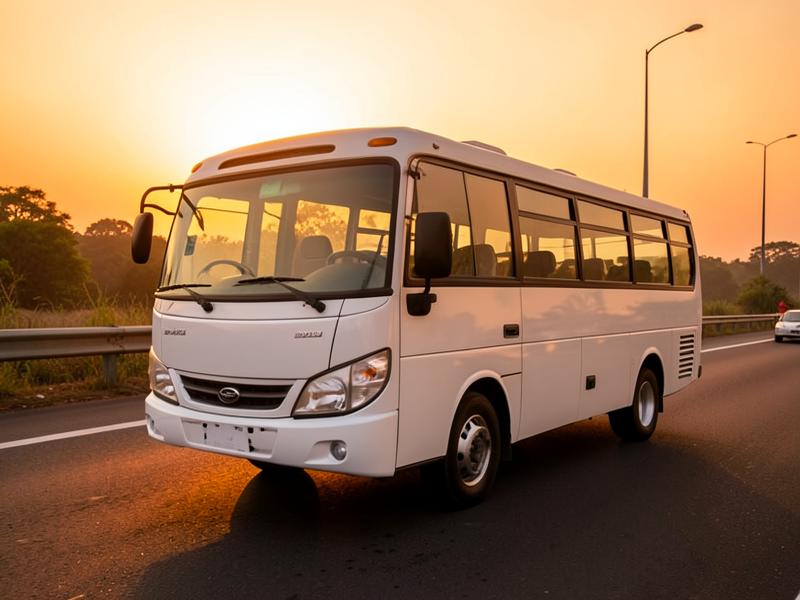 White 24-seat mini bus parked at dusk